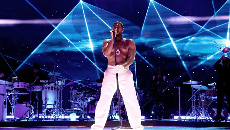 USHER performing live on stage